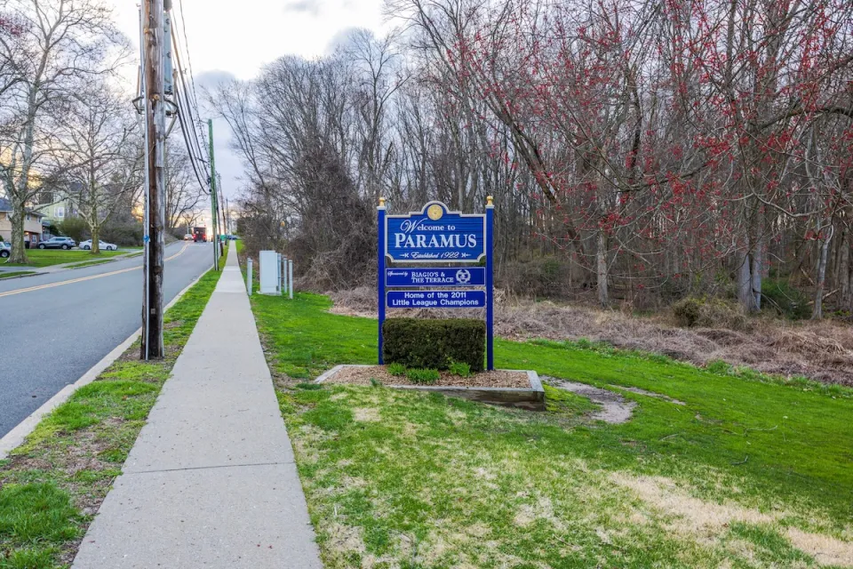 Blue and white Paramus, New Jersey town entrance sign.